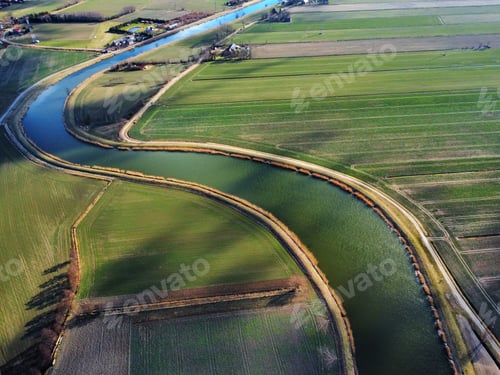 Preview: Drone shot of a river in a field
