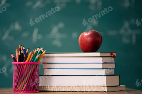 Preview: Pencils and book and blackboard. Education concept.