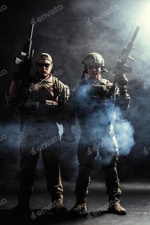 Preview: Military personnel stand ready with weapons and tactical gear in a smoke-filled environment