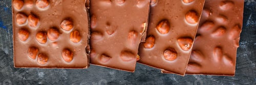 Preview: Chocolate Bar Hazelnuts And Almonds (Delicious Sweet Dessert Snack) Menu Concept. Background. Top
