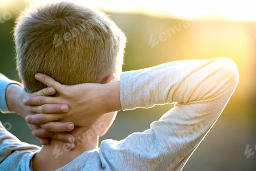 Preview: Child boy standing outdoors on summer sunny day enjoying warm weather outside. Rest and wellness
