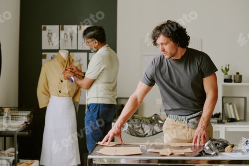 Preview: Biracial Coworkers Working on Collection Together