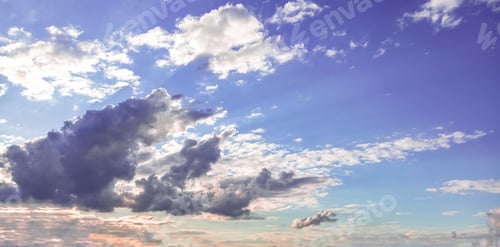 Preview: Cloud on blue sky background. Cloudscape grey and orange shade. Twilight light color the cloudy sky
