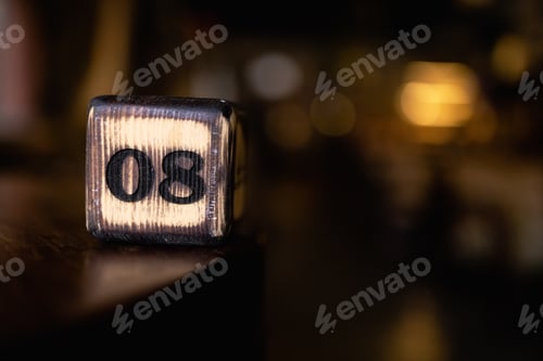 Preview: The number 08 on the wooden cube is burned with large symbols.