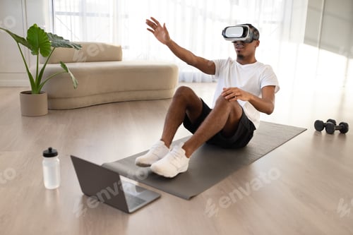 Preview: African american guy doing vurtual workout at home