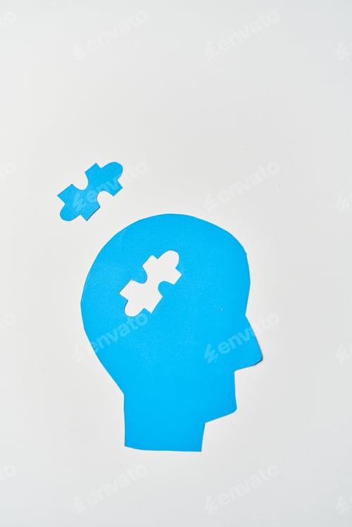 Preview: Alzheimer's disease, senile dementia and memory loss. Head silhouette with jigsaw puzzle