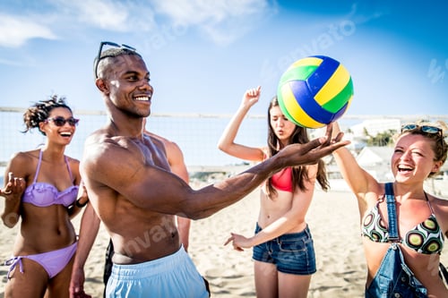 Friends play beach volley