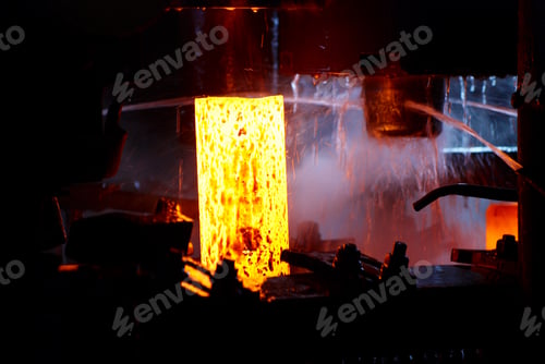 Preview: metal forging. hydraulic hammer shapes the red hot billet. the production of high tech parts