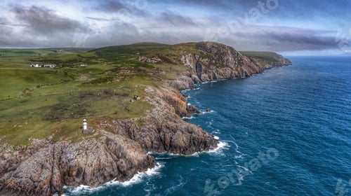Preview: Crammag head lighthouse with a lush island