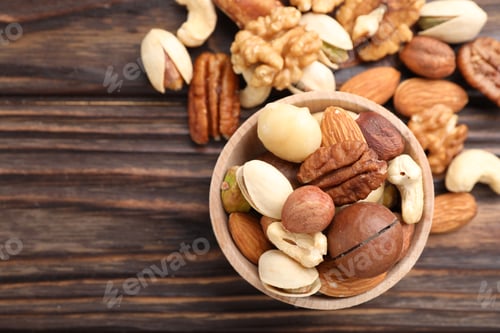 Preview: Mix of different nuts on wooden table, flat lay. Space for text