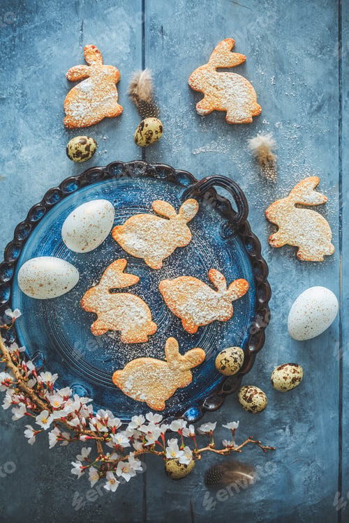 Preview: Homemade almond bunny cookies for Easter with Easter eggs in blue tone
