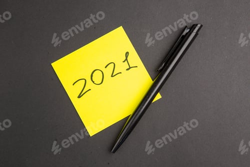 Preview: top view written on yellow sticky note pen on dark background