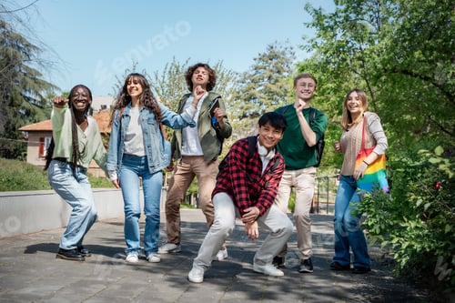 Preview: Diverse group of happy students enjoying outdoor fun together