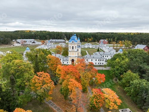 Preview: Monastery courtyard and church in vibrant autumn foliage