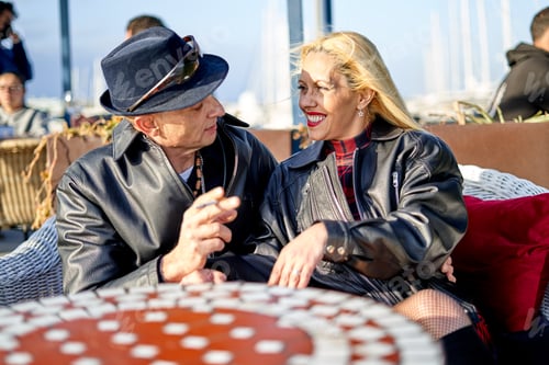 Preview: Couple Enjoying Sunny Afternoon at Outdoor Cafe