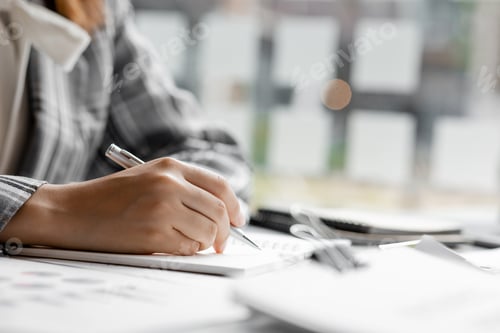 Preview: Businessman takes notes in a notebook, owns a startup company.