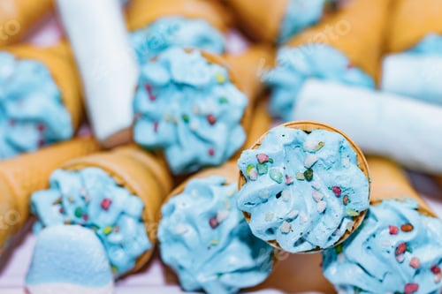 Preview: Blue trifle ice cream cones as props for a party.
