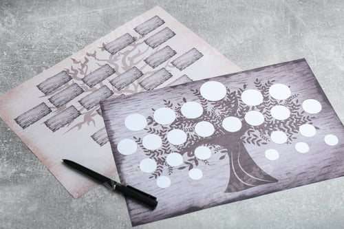 Preview: Blank family tree charts and pen on grey table