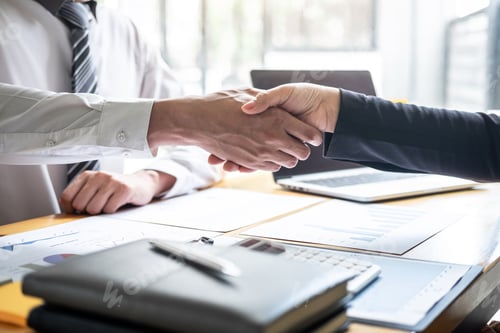 Preview: handshake of two business people after contract agreement to become a partner, collaborative