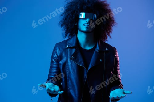 Preview: Portrait of fashion man with curly hair with stylish glasses on blue background multinational