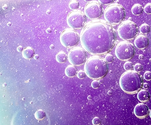 Preview: Beautiful shot of soap bubbles on a purple background with interesting textures