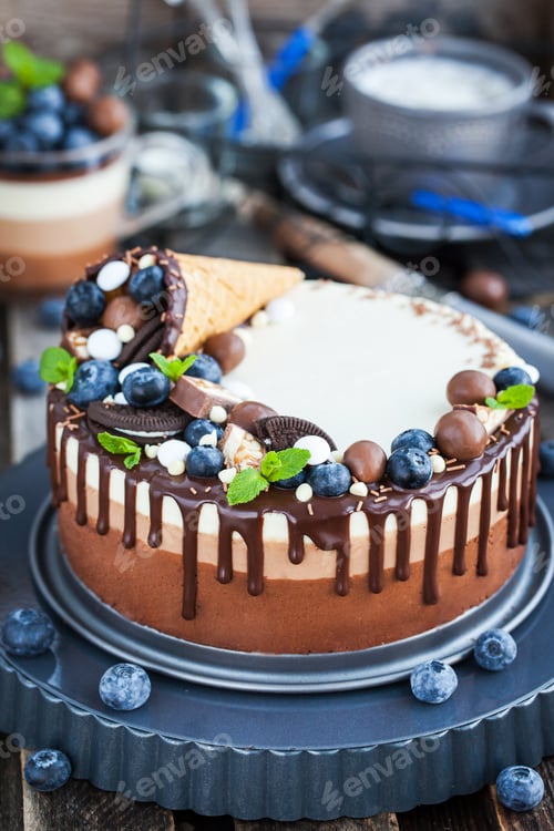 Preview: Three chocolate mousse cake decorated with waffle cone, fresh bl