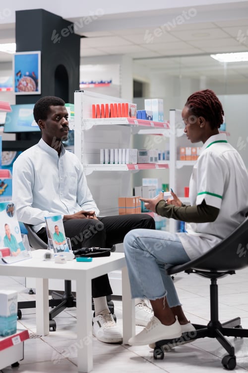 Preview: Pharmacist consultation, drugstore seller advising medicaments, holding pills package