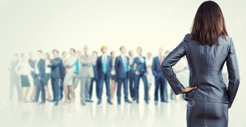 Preview: Powerful Businesswoman Standing With Back With Business Team At Background