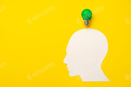Preview: Papercut head and light bulb on paper background