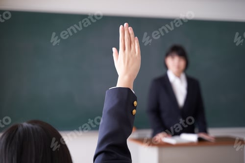 Preview: A Japanese junior high school girl raises her hand in the classroom