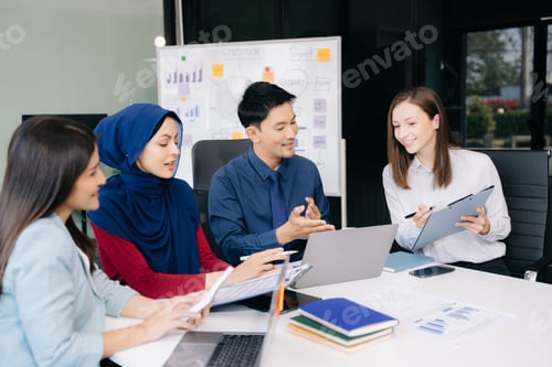 Preview: Creative business people working on business project in office