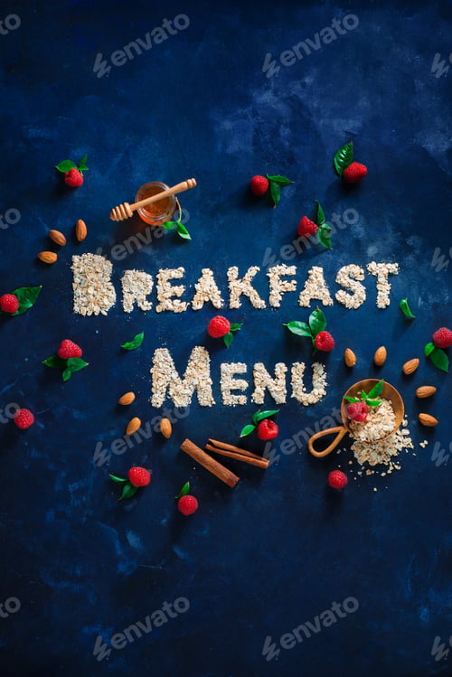 Preview: Breakfast Menu words written with oatmeal with raspberries and cinnamon. Healthy eating concept on a
