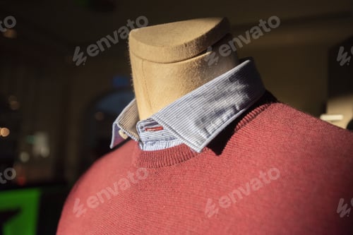 Preview: Closeup shot of a sweater with a gray collared shirt on a mannequin