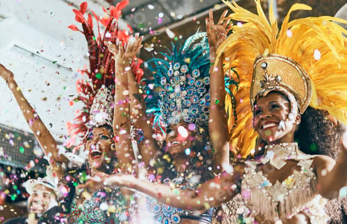 Preview: Cropped shot of beautiful samba dancers performing in a carnival with their band
