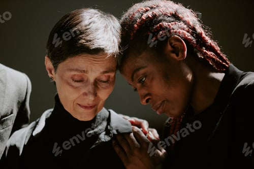 Preview: Women Crying Together at Funeral