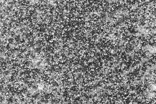 Preview: Abstract Texture Of The Frozen Asphalt With Ice Of Black Color And With White Grains Of Snow For A
