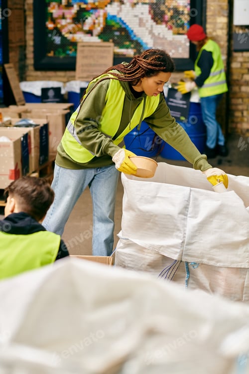Preview: Eco warrior in green: woman organizing boxes