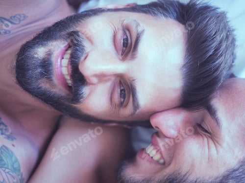 Preview: Two Men Smiling Together in a Close Embrace