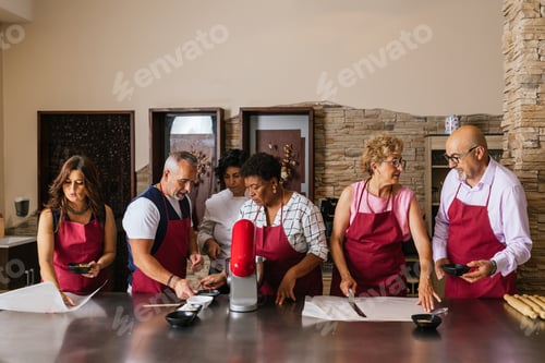 Preview: Chefs preparing food in restaurant kitchen during cooking course
