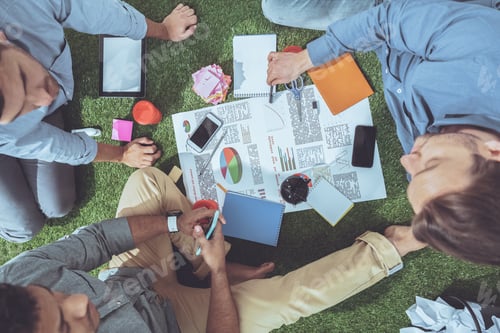 Preview: overhead view of business people working on new business plan, business teamwork