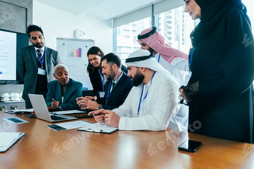 Preview: Multiethnic business team collaborating during a corporate meeting in dubai