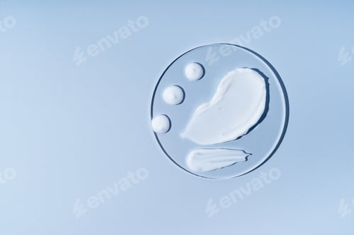 Preview: Natural white scrub and cream textured smears, smudges, on blue background, laboratory sample