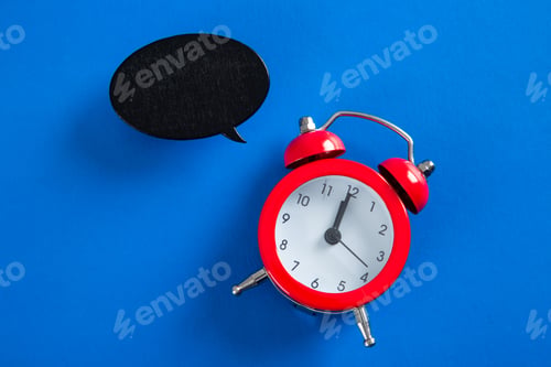Preview: Red alarm clock and speech bubble showing time management concept