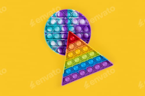 Preview: Two popit toy antistress for children and adults on a yellow background