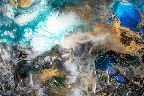 Preview: Closeup of epoxy resin with natural minerals, crystals and stones, painting of geode mixing colors.