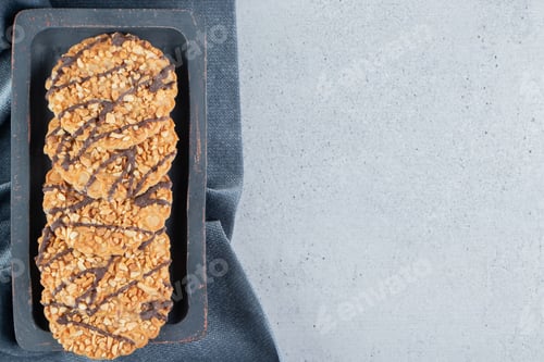 Preview: Cookie bundle on a wooden board next to tablecloth on marble background