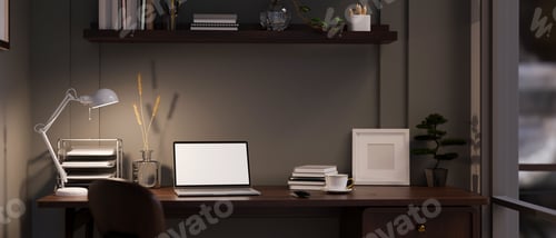 Preview: Modern dark office working space at night with laptop mockup on table against the black wall.