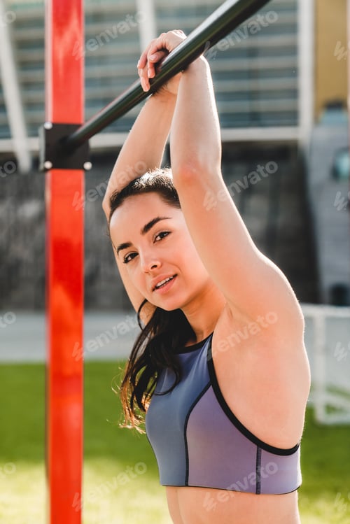 Preview: Vertical portrait of caucasian young good-looking girl doing fitness exercises
