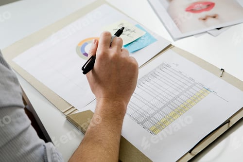 Preview: Fashion designer working at desk