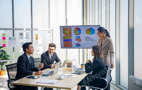 Preview: Group of young business people discussing and listening to coach having speech at business training